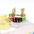 Colorful woven friendship bracelet with leopard pattern and LOVE 3D embroidery tassel - Style 51 Black Red/Green Flower
