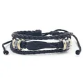 Multilayer black woven leather bracelet featuring a metal wing charm and adjustable pull cord - Black Wings