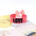 Bohemian coral pink woven bracelet with black embroidered LOVE text and tassels - Style 53 Black Tropical Print