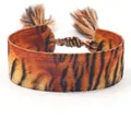 Ethnic woven friendship bracelet featuring tiger stripes pattern and orange tassels - B159