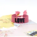 Pink woven wristband with leopard heart embroidery and fringe details for women - Style 60 White Pink Floral