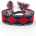 Ethnic style woven friendship bracelet with red and blue argyle pattern and tassels - B151