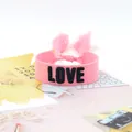 Pink woven friendship bracelet with embroidered LOVE text and decorative tassels - Style 61 Navy Ditsy Floral