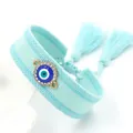 Braided Evil Eye bracelet with blue tassels and sparkling rhinestones on white background - Lake Blue (10#C)
