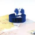 Blue woven cotton bracelet featuring black LOVE embroidery and decorative tassels - Style 70 Red/Green Geometric