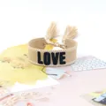 Beige woven canvas friendship bracelet with black LOVE embroidery and tassel detail - Style 71 Colorful Stripes