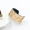 Detail of gold hollow geometric cuff with rose gold glitter and black leather lining - Gold Frame Gold Black Leather