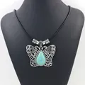Vintage zilveren vlinderketting met turkoois hanger aan een zwart leren koord - Holle Vlinder Stijl 2