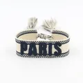 Bohemian embroidered PARIS friendship bracelet with tassel accents and woven texture - Black PARIS Embroidery Tassel / Black PARIS