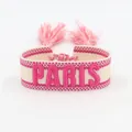 Colorful woven friendship bracelet featuring pink PARIS embroidery and soft tassels - Magenta PARIS Embroidery Tassel / Magenta PARIS