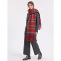 Woman in grey knit set wearing thick striped scarf with long tassels and chunky yarn - Burgundy