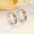 Macro shot of S925 sterling silver hoop earrings with five colorful square gemstones - Platinum Multi Zirconia