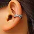 Close-up detail of an elegant silver crisscross ear cuff with sparkling zircon crystals - Silver (Silver 4147)