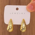 Exaggerated vintage gold C-shape spiral cone earrings on a jewelry display card - Gold Spiral Teardrop Earrings / 14K Gold (N-202)