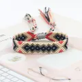 Handmade woven friendship bracelet with ethnic geometric patterns and colorful tassels - Beige Black Green Red Geometric Style (A#(9))
