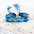 Macro shot of blue hand-woven friendship bracelet with ethnic geometric patterns - Blue Tone Geometric Style (A#(13))