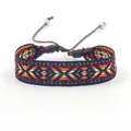 Macro shot of geometric diamond patterns on a colorful handwoven ethnic friendship bracelet - Style P (P#)