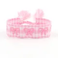 Bracciale intrecciato a scacchi rosa e bianco con farfalle ricamate e chiusura a nappine - Fiocco Rosa