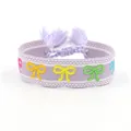 Bracciale etnico ricamato con fiocchi colorati e nappe color lavanda - Fiocco Multicolore Viola