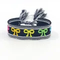 Bracciale etnico in tessuto con farfalla ricamata colorata e nappe con frange nere - Fiocco Multicolore Nero