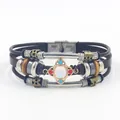 Bohemian multi-layer leather bracelet with metal beads and gemstone center on white background - Brown Leather Geometric Flower