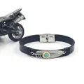 Detail of silver feather charm with turquoise inlay on a black leather bracelet - Black