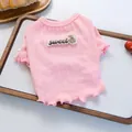 Dettaglio della maglietta in maglia rosa per animali con toppa di orso e bordo a onde - XS / Rosa
