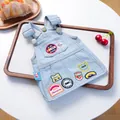 Retro denim pet dress with vintage patches and metal buckles on a wooden tray - XS / Light Blue