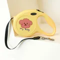 Ergonomic retractable pet leash in bright yellow with cartoon dog pattern and nylon rope - Baby Puppy Style / Bright Yellow