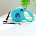 Detail of mint blue retractable dog leash with purple monster cartoon and metal hook - Mint Green