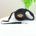 Detail of retractable dog leash with cartoon dog motif and durable metal swivel hook - Happy Dog Style / Black