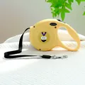 Detail view of the yellow retractable pet leash featuring a sturdy metal rotating buckle - Yellow Monster Style / Bright Yellow