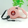 Pink retractable dog leash with monster cartoon design and ergonomic handle on soft rug - Brown Monster Style / Light Pink