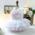 Detail showing pink sequins and pearl trim on a luxury pet wedding dress for dogs - Blooming Button Dress
