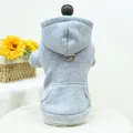 Close-up of light grey pet hoodie featuring a metal D-ring for leash and functional pocket - Gray