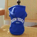 Detail of navy blue pet hoodie featuring white New York embroidery and cozy pocket design - XS / Sapphire Blue