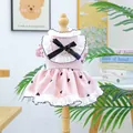 Close-up of pink pet dress with black heart patterns, lace hem, and a black bow detail - Small Heart Tutu Dress - Pink