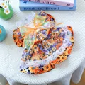 Detail of floral pet dress with orange organza bow and white lace trim for small dogs - Orange Blossom Floral Dress