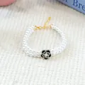Elegant double-layered pearl pet bracelet with a black and white camellia flower pendant - Double Chain Camellia Pearl Necklace