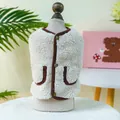 Close-up of cream fleece pet vest with brown trim and vintage buttons on a model - XS / Brown Border
