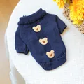 Detail of dark blue pet knit sweater with bear patches and ribbed cuffs on white mesh - Cookie Bear Sweater - Navy Blue