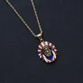 Golden tribal necklace with a colorful Indian chief pendant and twisted rope chain - Gold