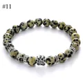 Detail of dalmatian jasper stone bead bracelet with a silver animal paw print charm - Dalmatian Stone Style(#11)