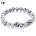 Detailed close-up of 8mm white turquoise beads bracelet with a silver paw charm - White Turquoise Style(#14)