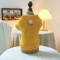 Detail of ginger pet sweatshirt featuring metal D-ring for leash attachment and knit fabric - Yellow