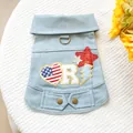 Detail of light blue denim dog vest with American star patches and metal D-ring attachment - XS / Light Blue (USA Star Denim)