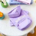 Close-up of purple pet hoodie featuring white New York embroidery and soft fleece texture - XS / Purple
