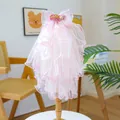 Macro detail of pink layered tulle pet wedding veil with a sequined fish bow on a stand - Iridescent Pink Fish Style