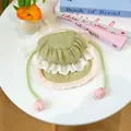 Detail of a retro Lolita dog hat in matcha green with lace trim and tulip ties - S / Green Bonnet Hat