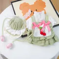 Detail of green pet dress with lace edges, pink bows and cherry charms for small dogs - XS / Cherry Cake Dress And Hat Ensemble